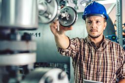 Man using tablet at Natural gas processing facility