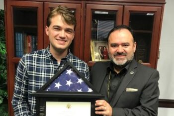 TJC alumnus presents U.S. flag to TJC president for branch locations