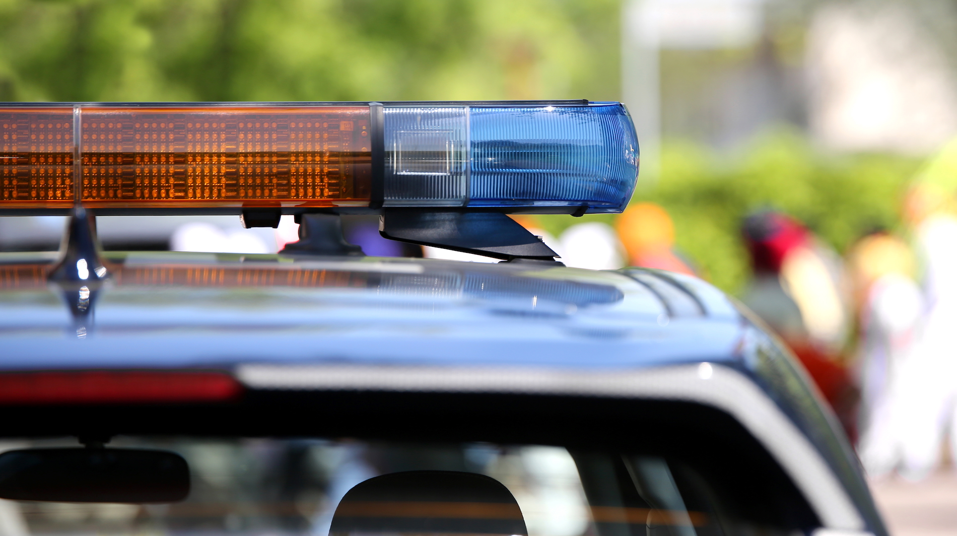 Police vehicle with emergency light bar, lights off