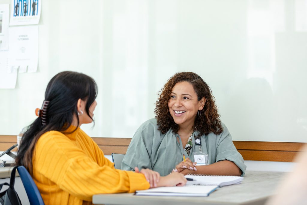 College professor tutors student after class