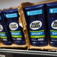 Right Guard deodorant in a box displayed on a shelf, showcasing its packaging and branding.