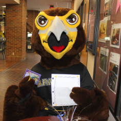 Tjc Harry the Hawk holding letter
